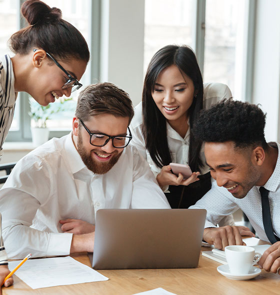 Office workers collaboratively doing accounting work as a group