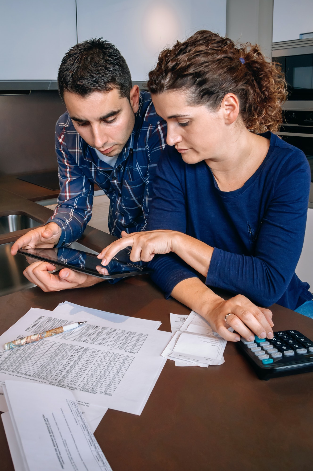 Office girl and office boy looking at a tablet for accounting service