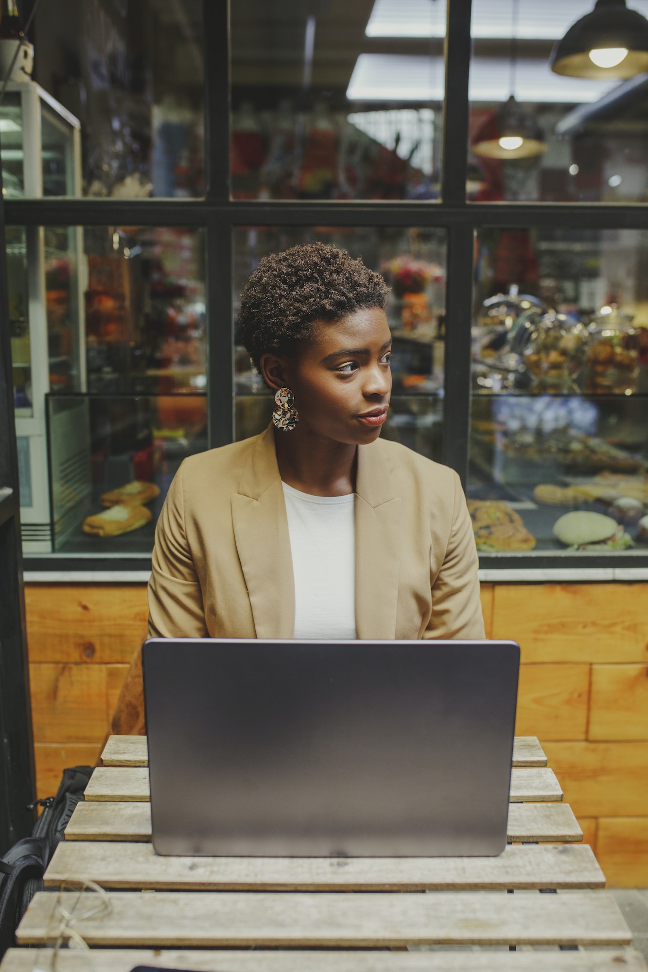 Bookkeeper for a dentist, a girl with a laptop, looking to the side