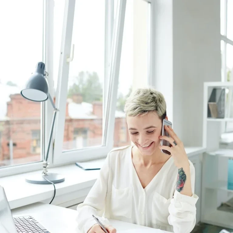 Business specialist provides expert advice during phone consultation at contemporary workspace