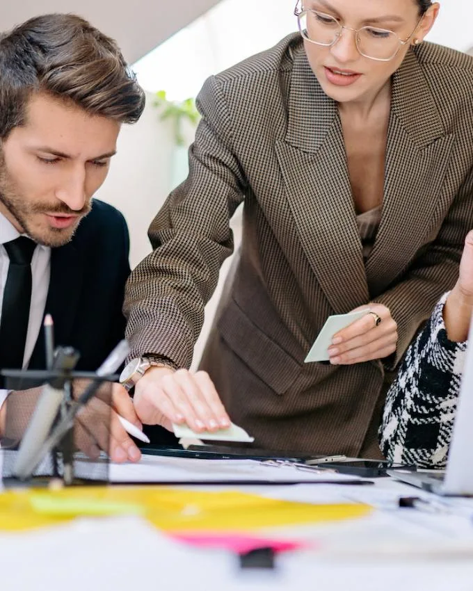 Professionals reviewing documents for International Tax Planning for High-Net-Worth Individuals (HNWI).