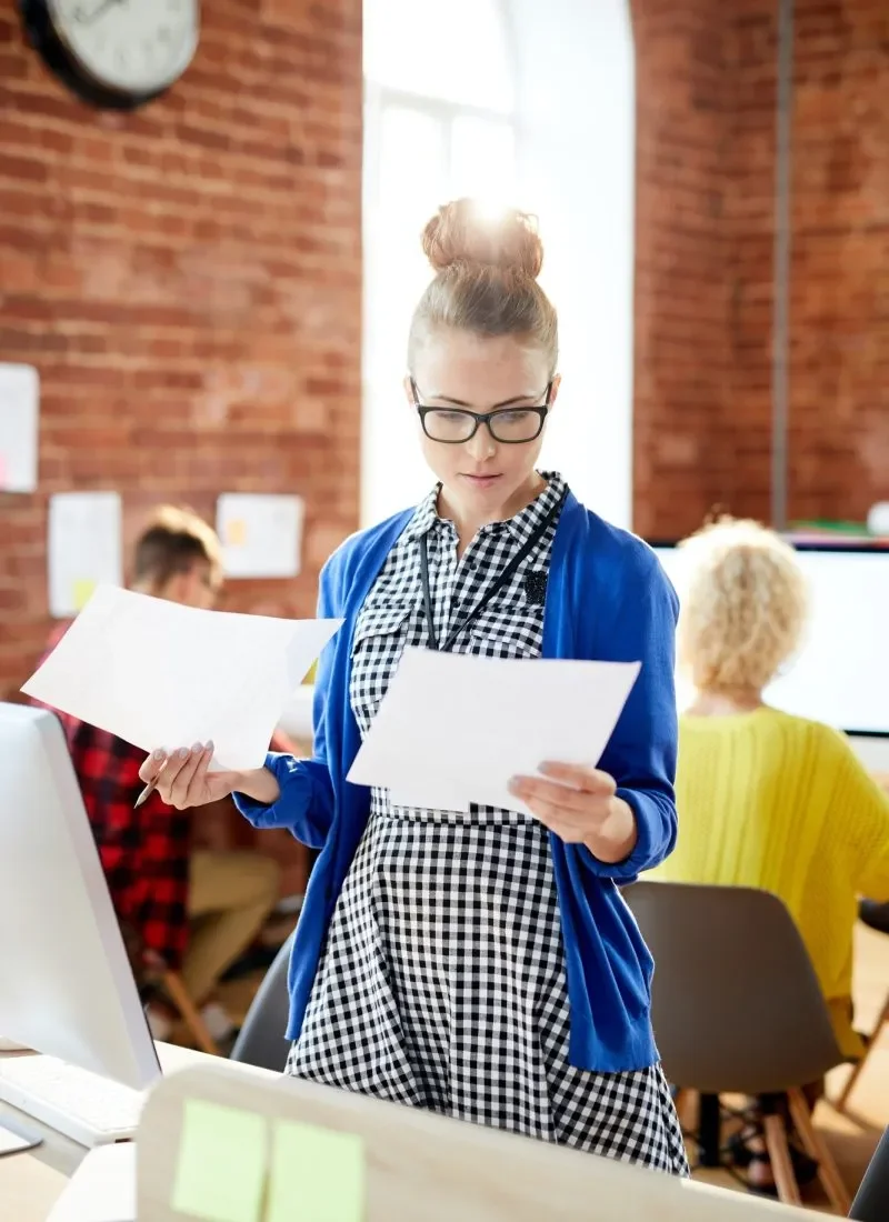 accountant reviewing documents at desk