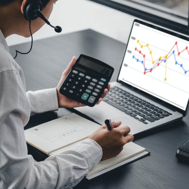 Accountant using a calculator to calculate the numbers. Accounting , Accountancy from financial