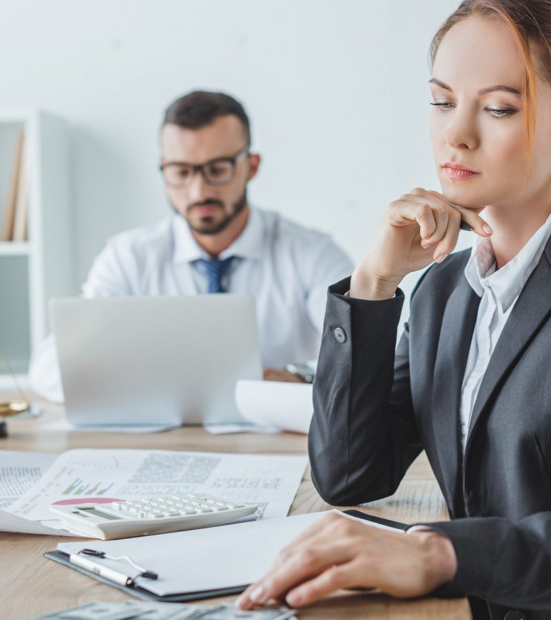 accountants working in office with documents and laptop charity accountant
