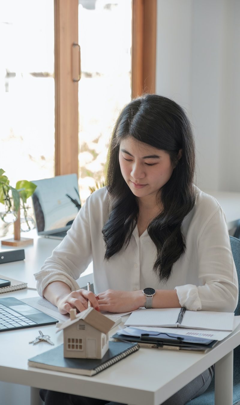 Office girl wearing a white shirt doing her job of bookkeeping and accounting