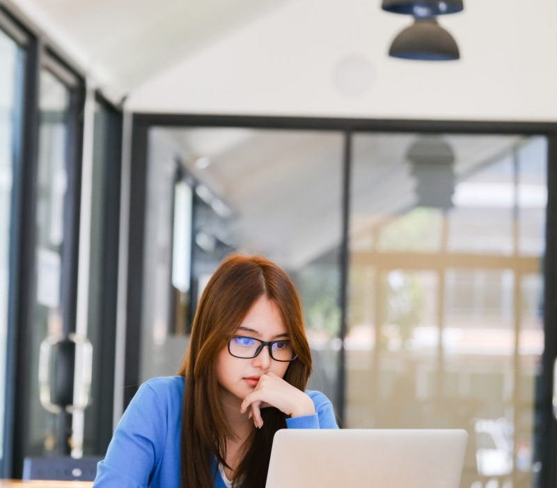 Businessman analyse investment marketing data. Young girl in a blue dress using a laptop for bookkeeping for farm work