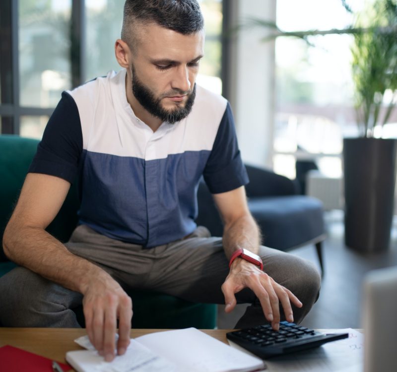 Businessman feeling involved in calculations and accounting, Small Limited Company Accountant