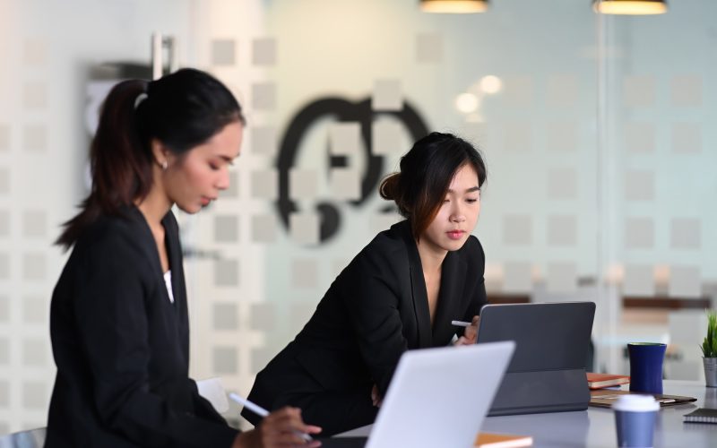 Businesswoman in suit experts discussing information during accounting process in office. Businesswoman in suit experts discussing information during accounting process in office, Accountants for Business Owners, Tax Consultants For Small Businesses