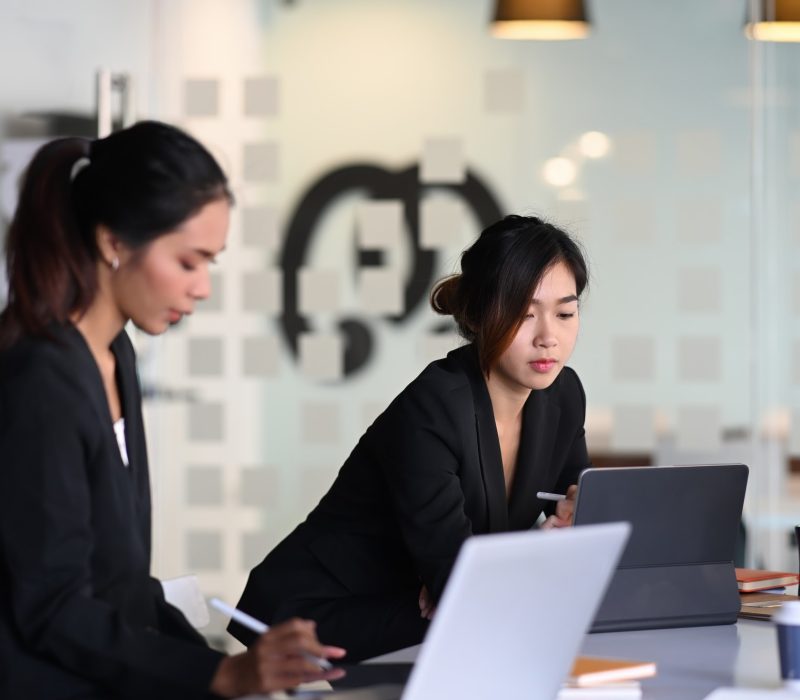 Businesswoman in suit experts discussing information during accounting process in office. Businesswoman in suit experts discussing information during accounting process in office, Accountants for Business Owners, Tax Consultants For Small Businesses