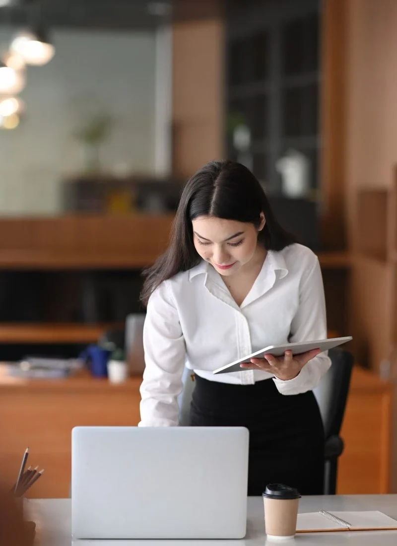businesswoman working with laptop and tablet