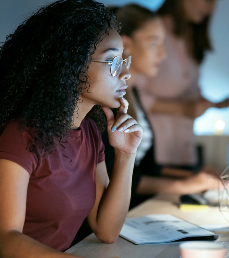 Confident young business woman working with laptop sitting in the office, Accountants for Artists, Bookkeeping For Dentists, Tax Planning For Contractors