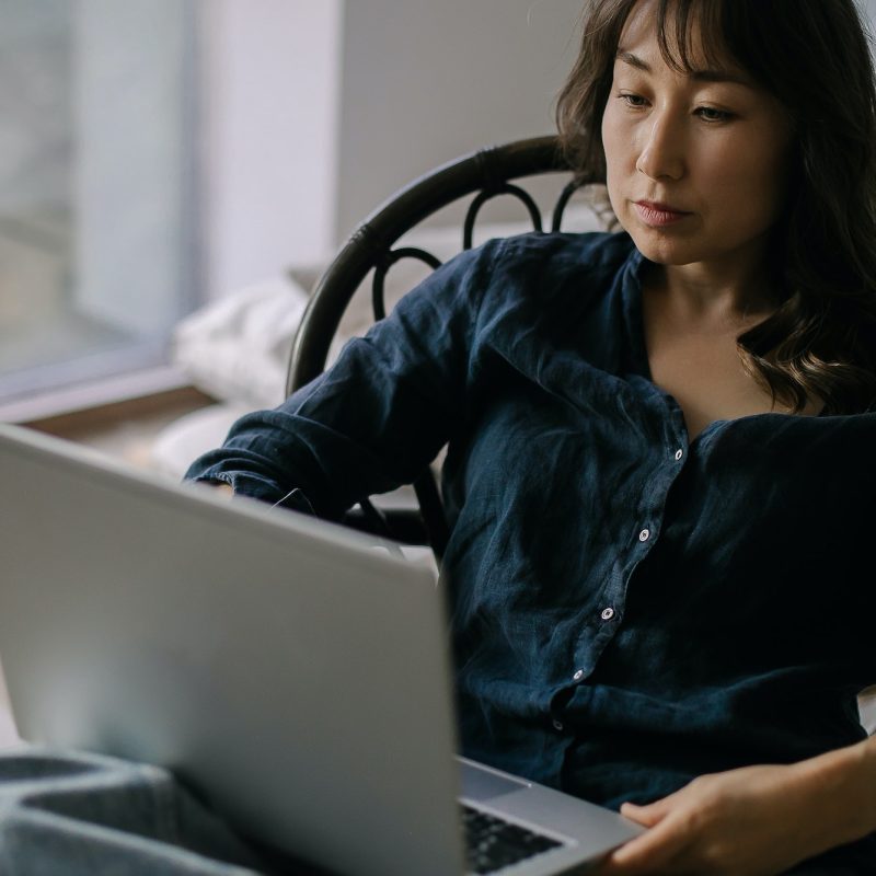 Female freelancer working remotely on laptop from home, Self Assessment Accountant