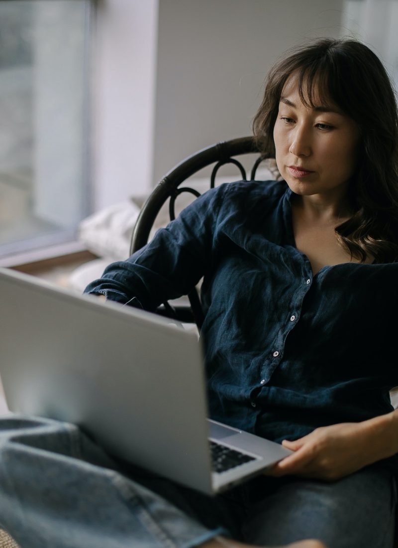 Female freelancer working remotely on laptop from home, Self Assessment Accountant