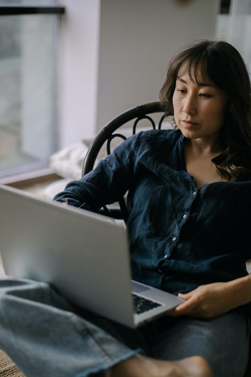 Female freelancer working remotely on laptop from home, Self Assessment Accountant