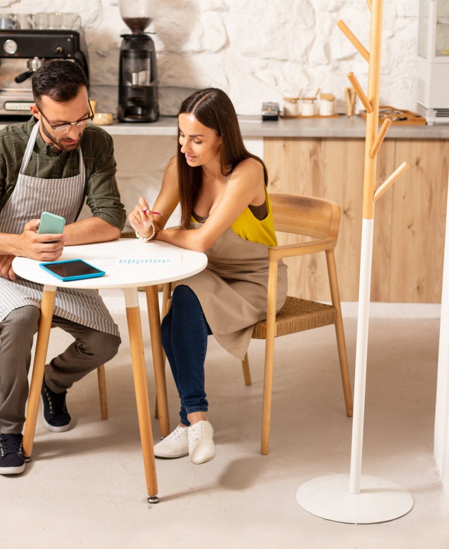 Boy teaching accounting and bookkeeping to the girl
