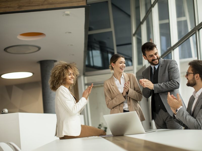 Four bookkeepers for real estate agents clapping