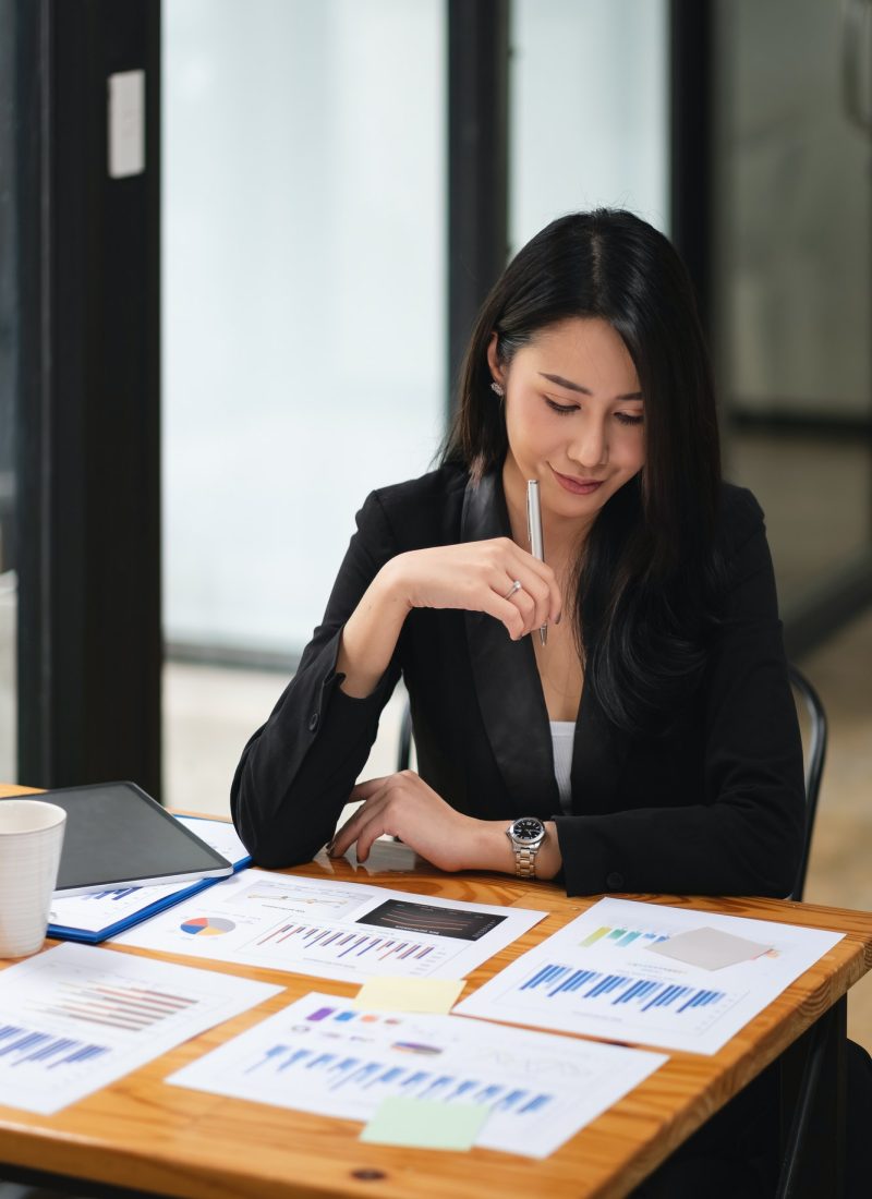 Portrait Of Attractive Asian Businesswoman Working for marketing plan. business analysis,financial