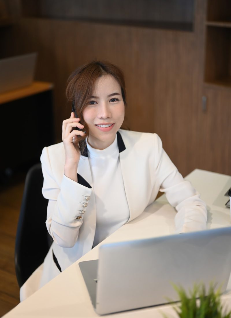 Portrait of successful businesswoman talking on mobile phone.