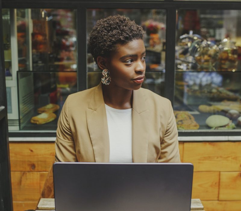Bookkeeper for a dentist, a girl with a laptop, looking to the side