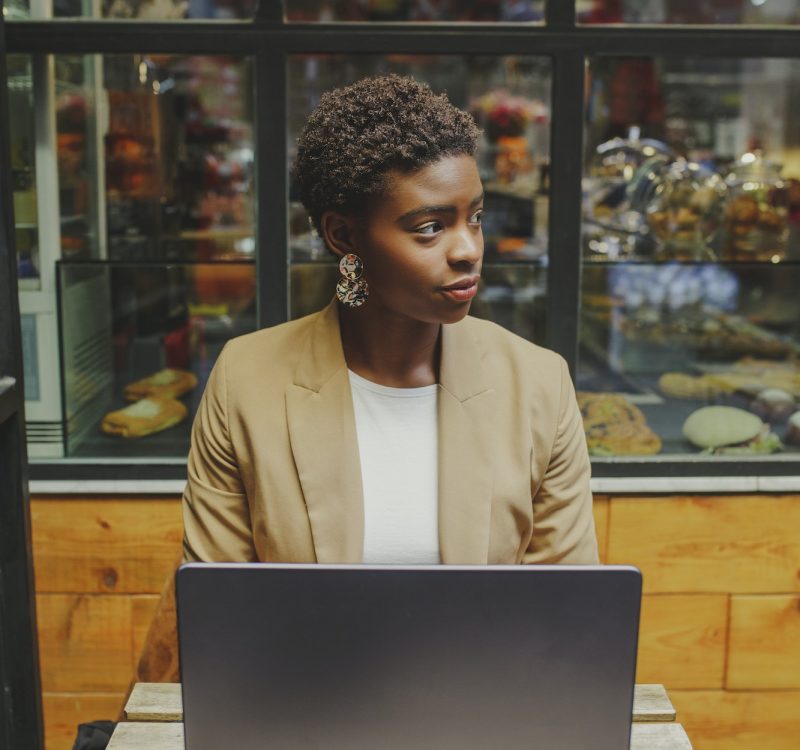 Bookkeeper for a dentist, a girl with a laptop, looking to the side
