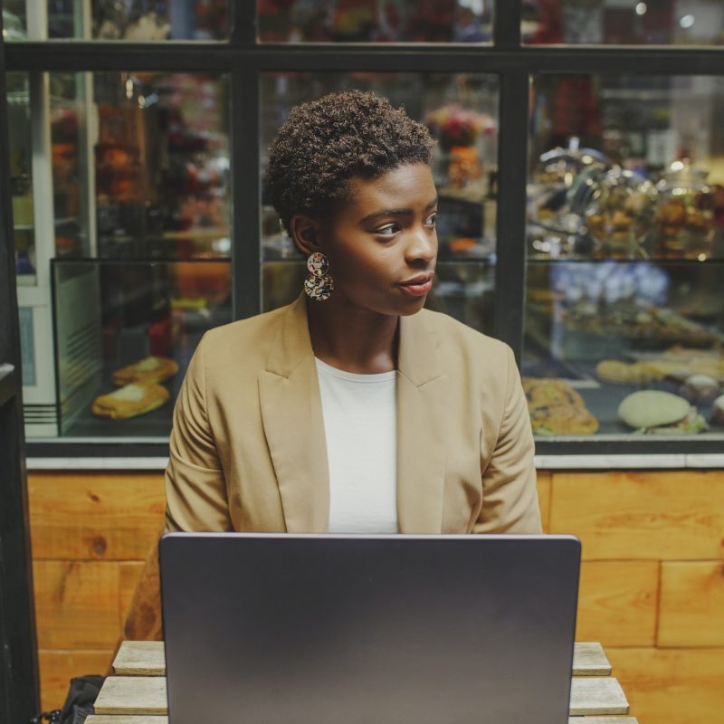 Bookkeeper for a dentist, a girl with a laptop, looking to the side