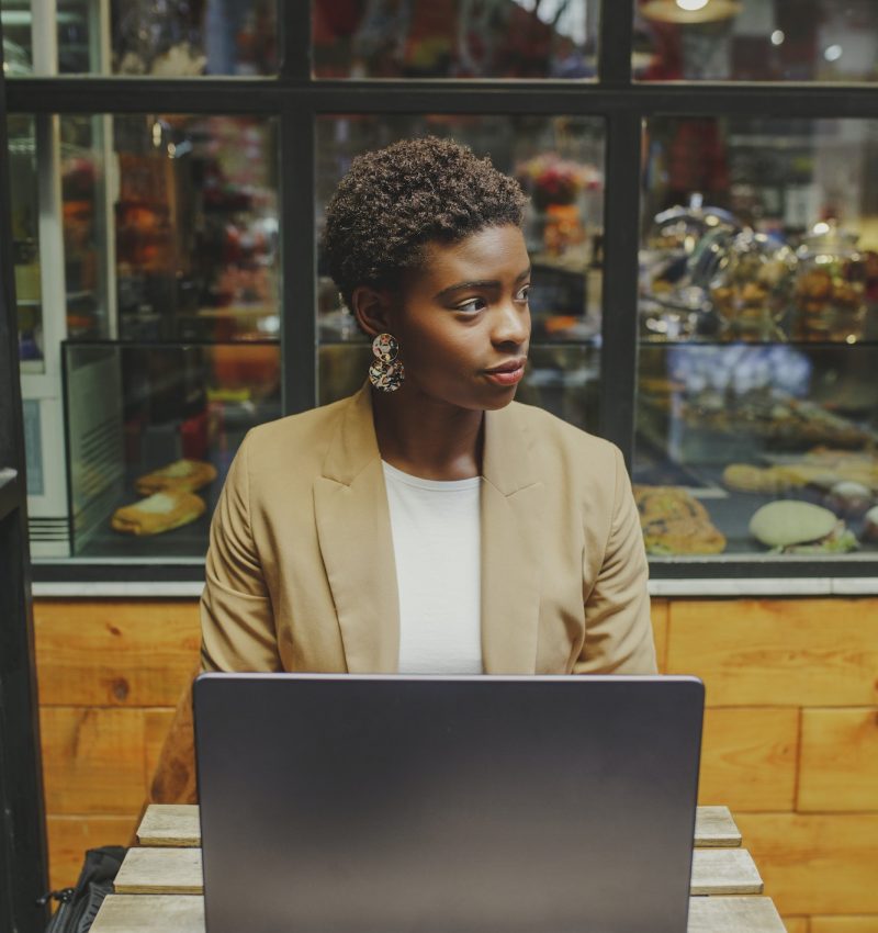 Bookkeeper for a dentist, a girl with a laptop, looking to the side