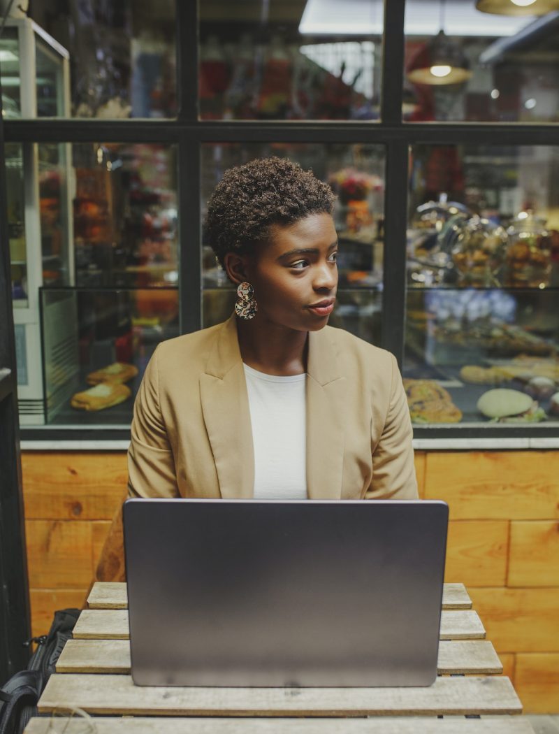Bookkeeper for a dentist, a girl with a laptop, looking to the side