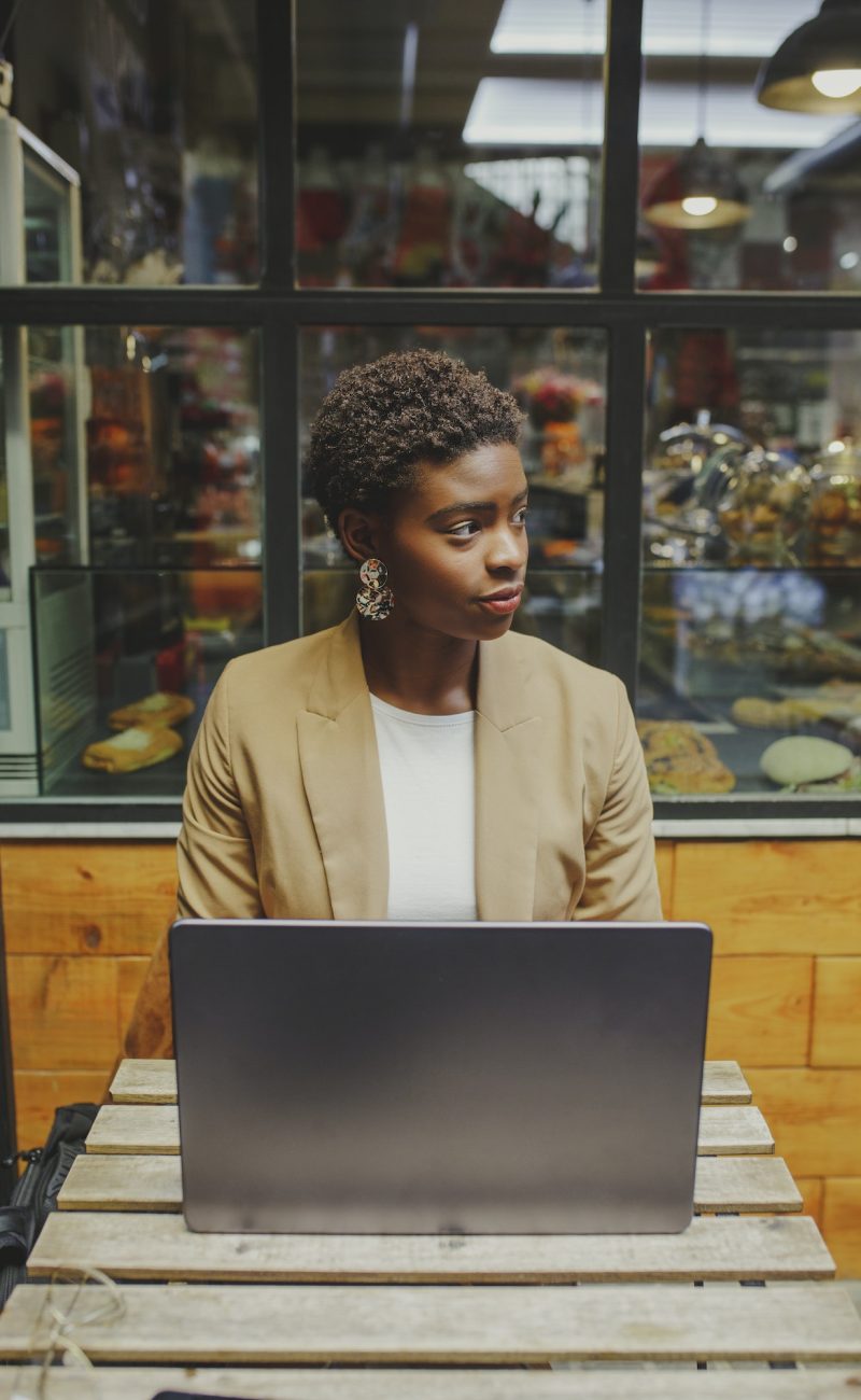 Bookkeeper for a dentist, a girl with a laptop, looking to the side