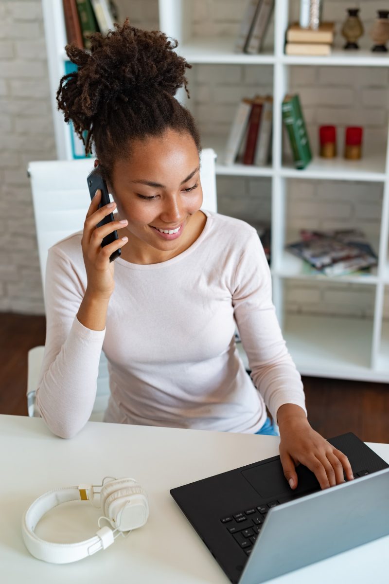 Smiling woman working on laptop in the office and talking on a smartphone . – Image Smiling woman working on laptop in the office and talking on a smartphone . - Image, Accountants for Landlords
