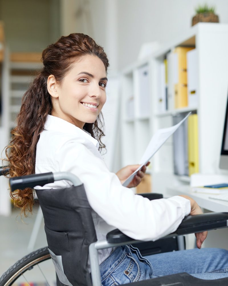 Young accountant in wheelchair, Corporate Tax Accountant