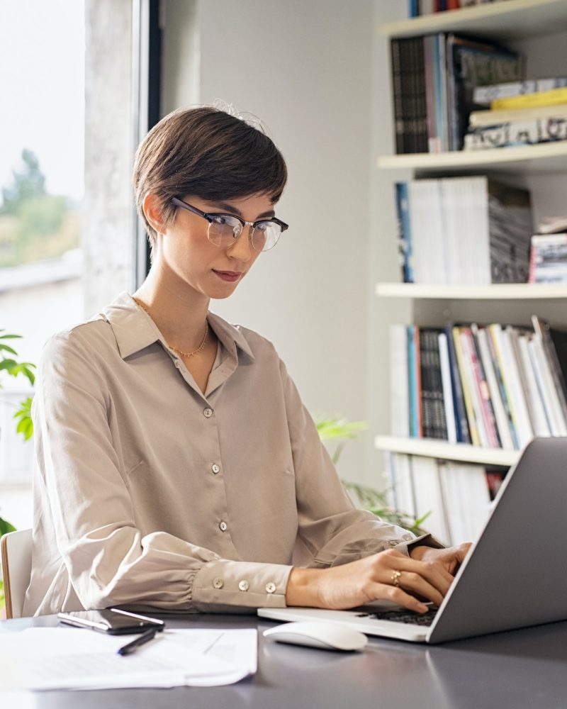 Office girl doing accounting in her laptop for gamblers