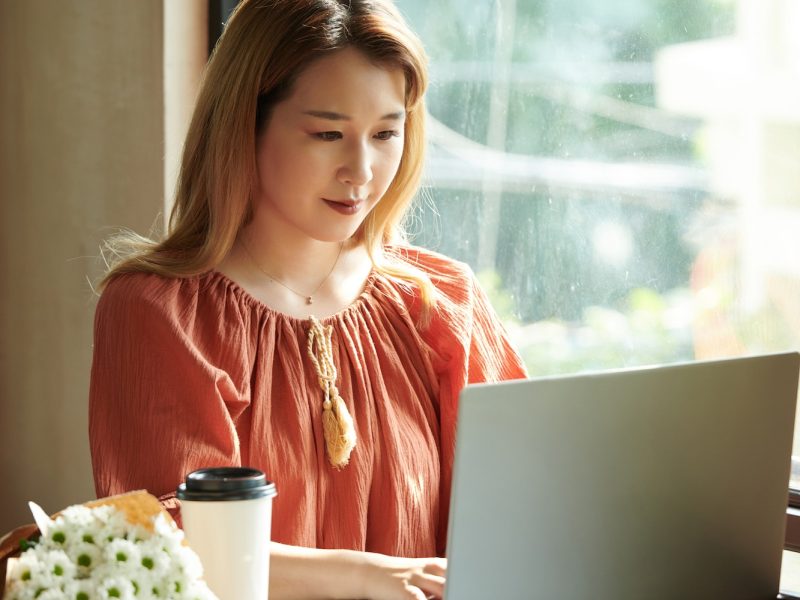 Young girl using a laptop for bookkeeping and accounting services