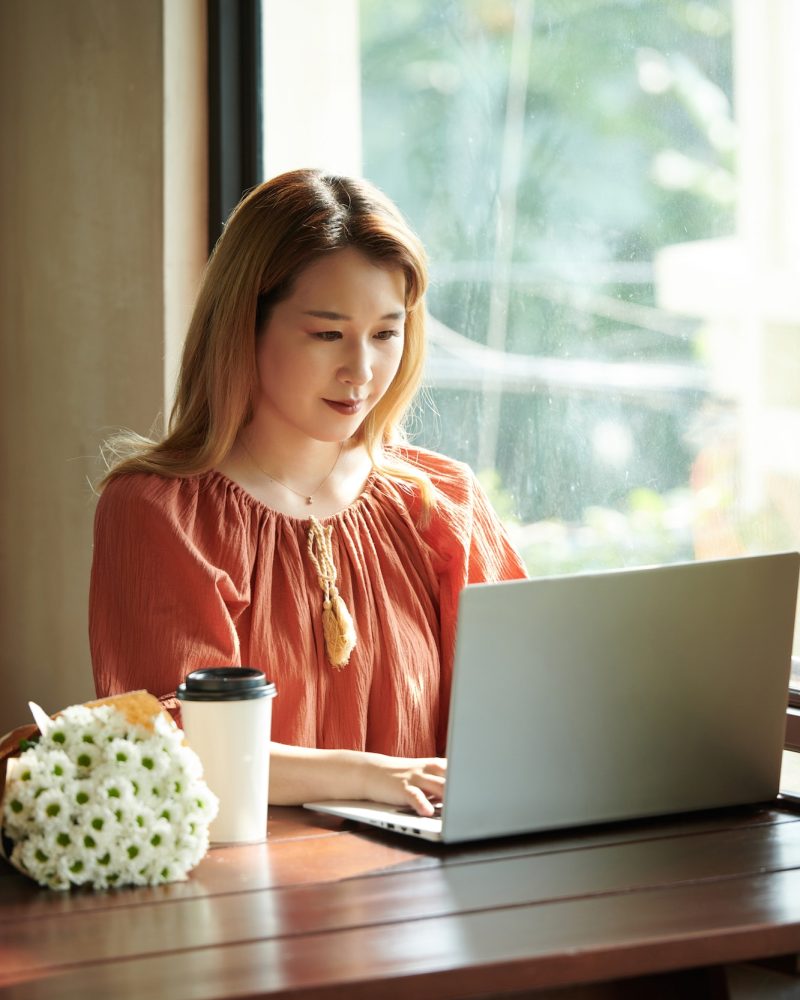 Young girl using a laptop for bookkeeping and accounting services